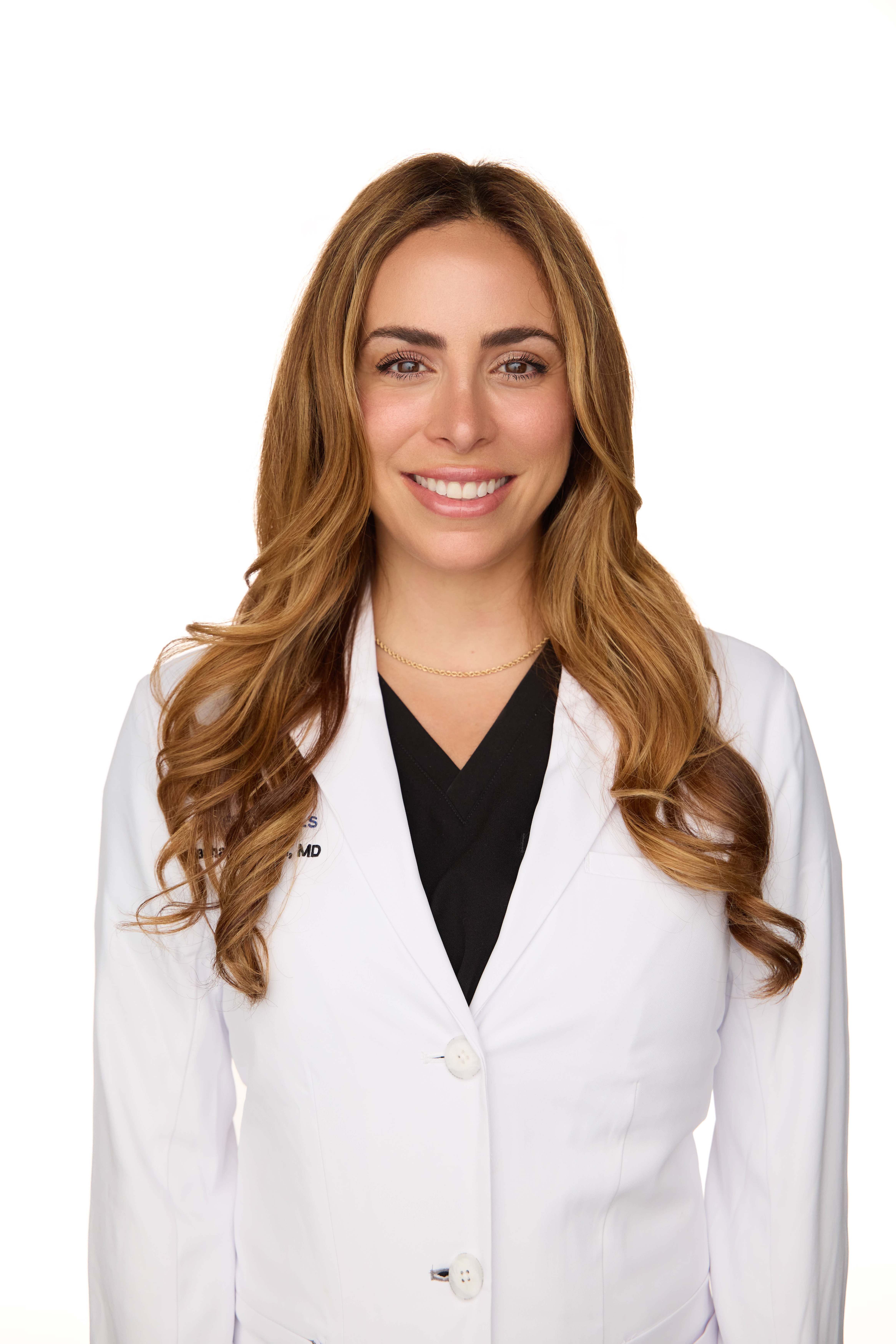 Dr. Hakman in a white coat